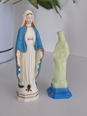 Two plastic religious figurines with Imperfections